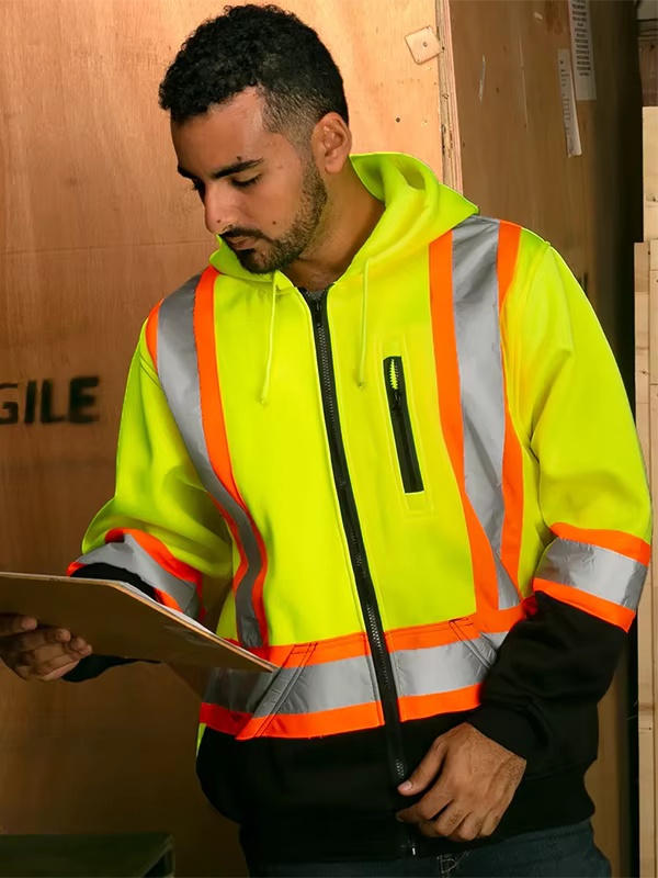 Warehouse worker wearing a reflective safety hoodie