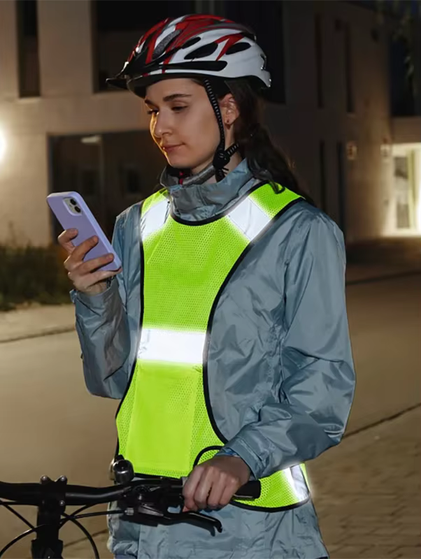Cyclist wearing a sport reflective vest