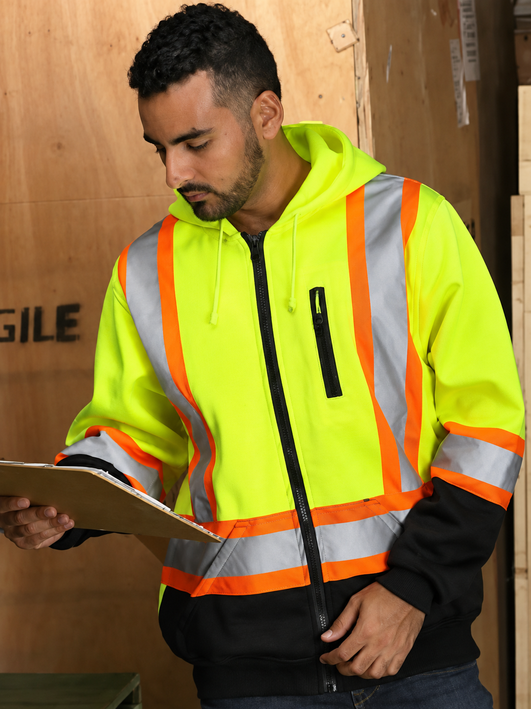 Warehouse worker wearing a reflective safety hoodie