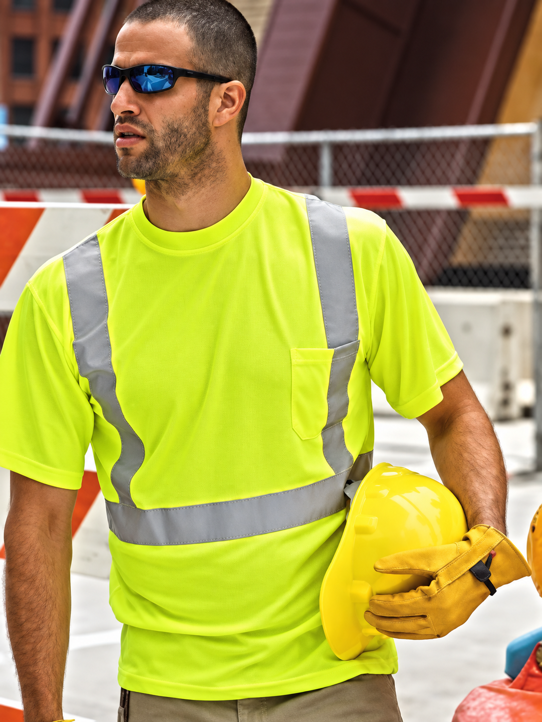 Construction worker wearing a yellow reflective safety shirt
