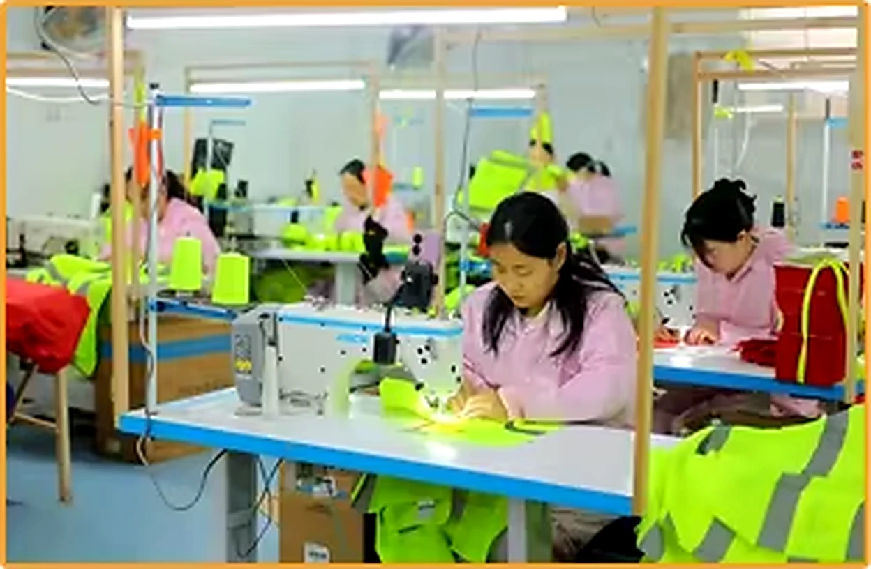 Sewing team constructing high visibility garments