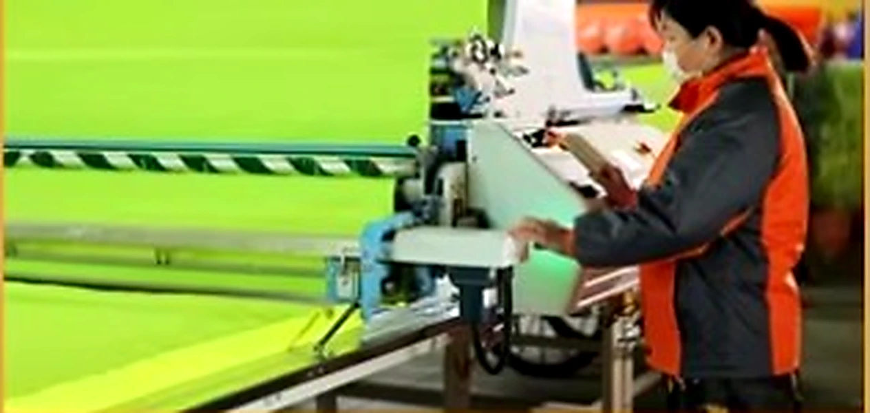 Fabric spreading before the pre-holiday production peak: capacity tightens weeks before the shutdown.